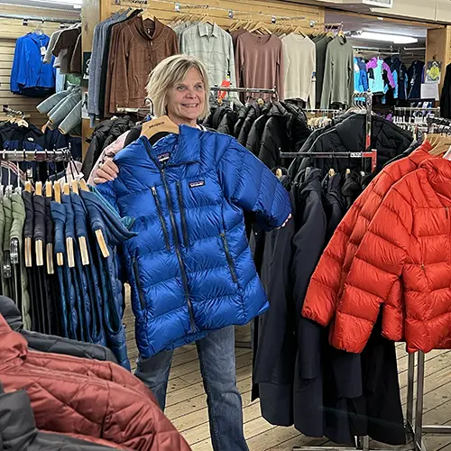 Woman standing in a clothing section of FarmWay